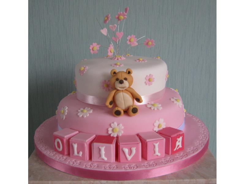 Teddy Bear - Christening cake in lemon and madeira sponges for Olivia in Broughton with pink and white sugarpaste flowers and building blocks
