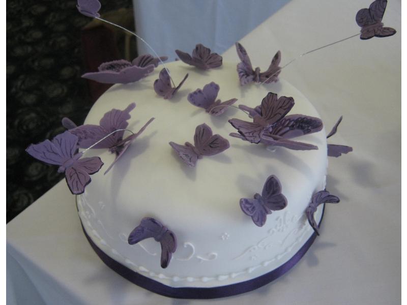 Cake with butterflies for Cadbury-themed wedding of Hayley at Ribby Hall and from Lytham in Madeira