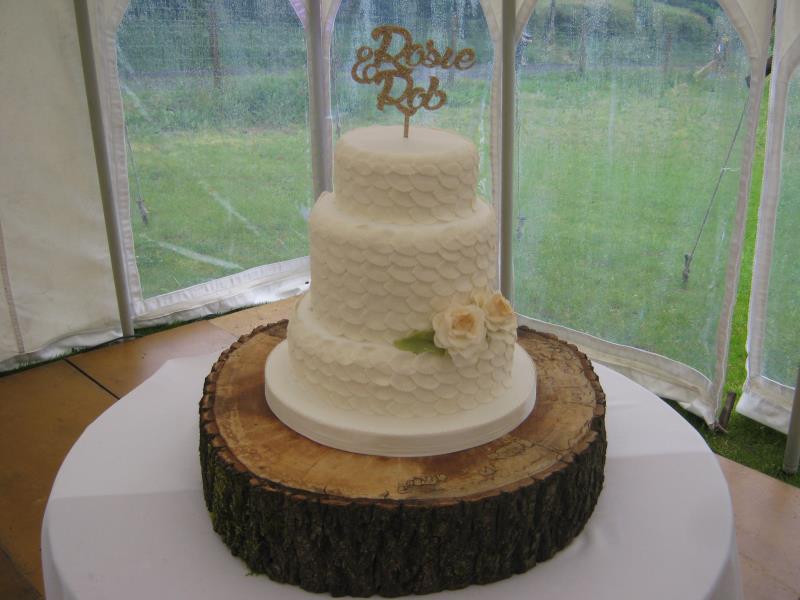 Leaves in white for Rosie & Rob's wedding in Derbyshire from fruit cake.Decorated in white sugarpaste leaves