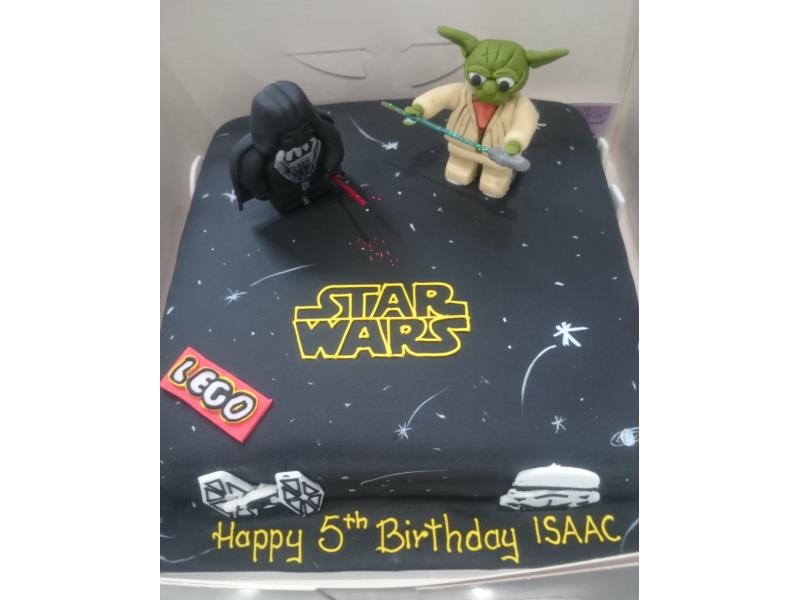 Star Wars themed cake with Yoda, Stormtroopers and Darth Vader as well as Lego logo, made from chocolate sponge for Isaac in Lytham