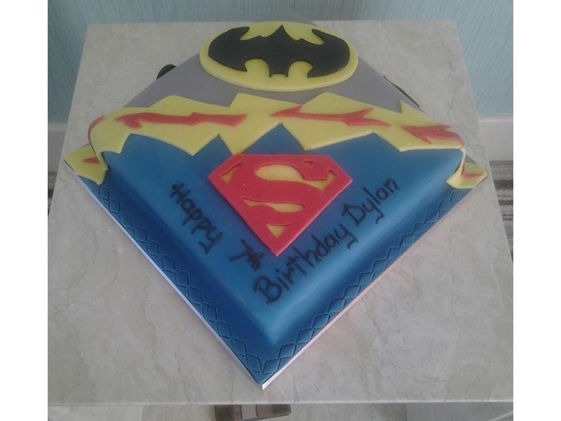Batman Superman logos on Dylan's birthday cake made from chocolate sponge