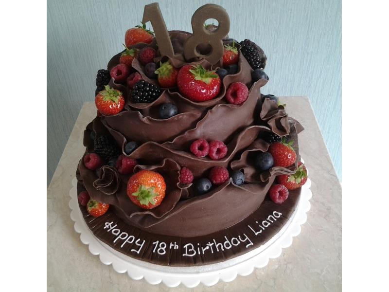 Chocolate cake with fresh fruit, made from chocolate sponge  and coated in chocolate sugarpaste for Liana in Staining