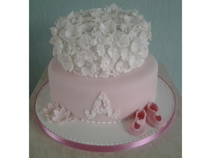 Laura  Chrsitening Cake in Madeira. 2 tiers in pink and white with flowers