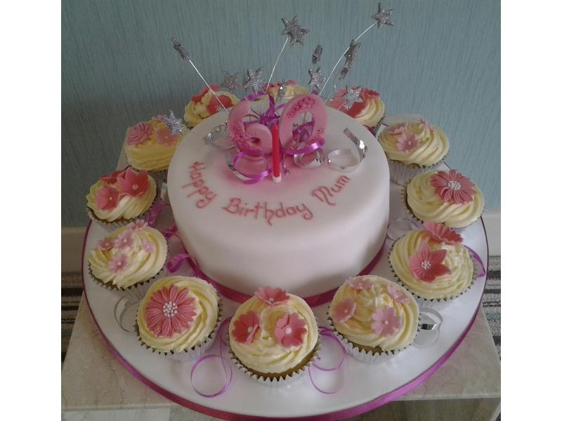 Mum's 60th for Anna in Cleveleys wwith cupcakes and main cake in vanilla sponge, with starburst and ribbons