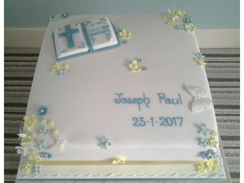 Boy's Christening Cake for Joseph paul in Bispham, with 2 tiers of vanilla sponge. decorated with bible and cross