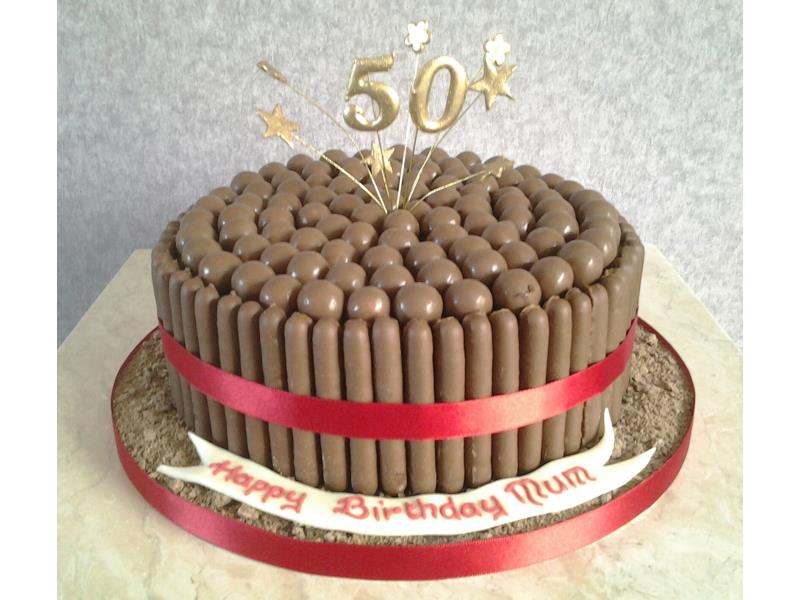 Cadbury birthday cake with Maltesers nd Chocolate finders around a chocolate sponge. Made for Claire's Mum in Layton on her 50th birthday