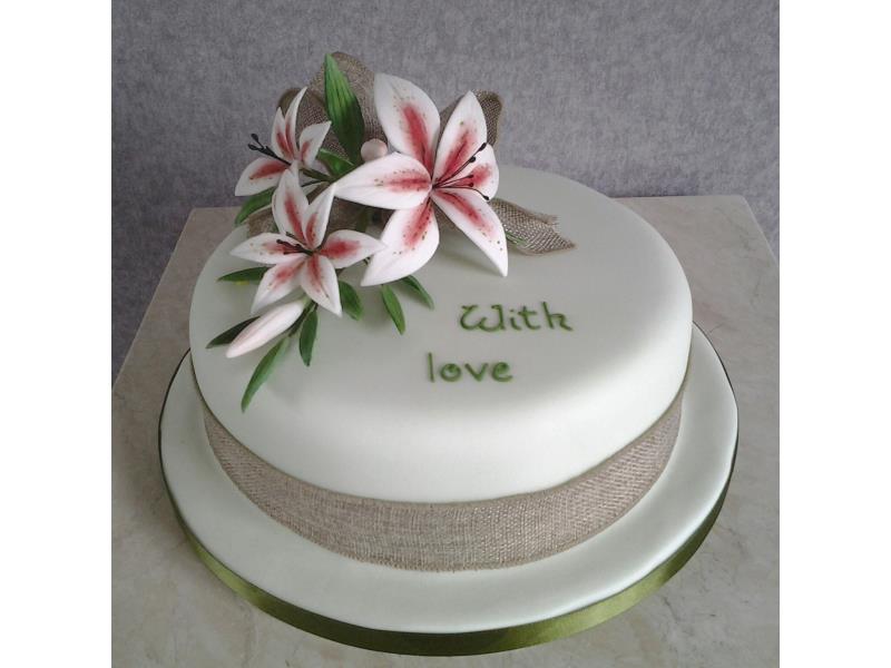Elegant with liles for Madge's birthday in Sheffield, made from fruit cake.