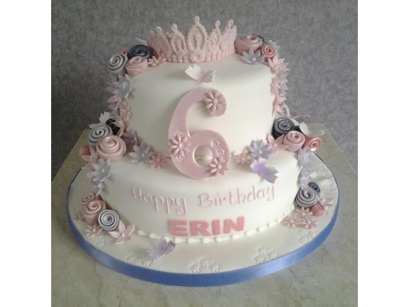 Pink Tiarra with roses in shades of pink on 2 tiers of chocolate sponge for Erin's 6th birthday in Blackpool