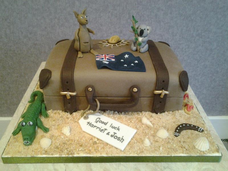 Emigrating - suitcase and Australia icons for Harriet & Josh in Blackpool. Made from chocolate with orange sponge