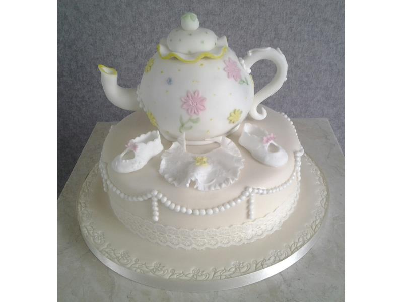 Teapot - baby shower showing teapot and baby bootees and dummy. Cake made from vanilla sponge for Lauren