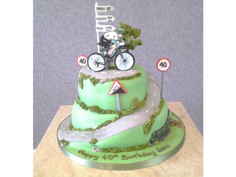 Racing cyclist on a 'hill' of chocolate and lemon sponges for 40 year old John in Bispham