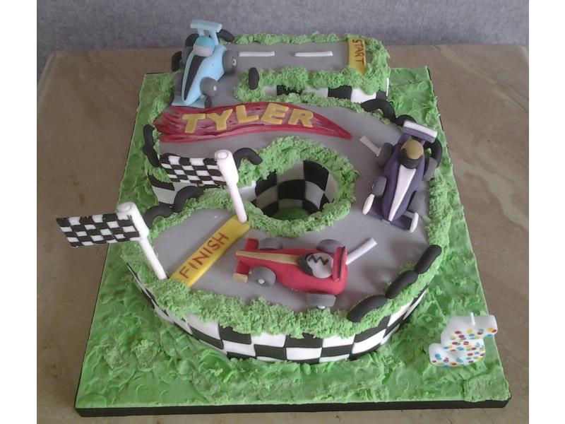 Racing cars and track birthday cake