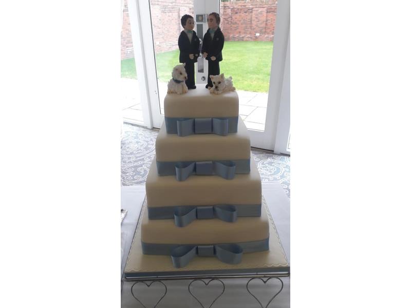 Elegant 4 tier wedding cake for a friendly couple of guys and their canine friends