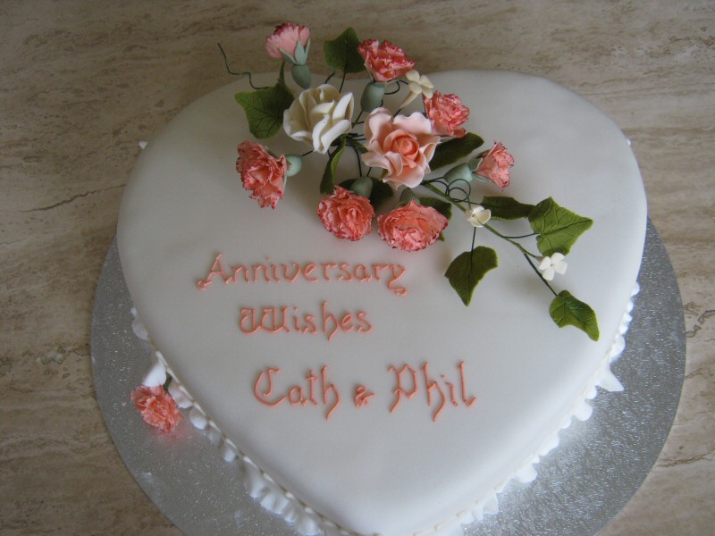 Phil and Cath - Peach carnations on a heart shaped cake for Phil and Cath's wedding anniversary